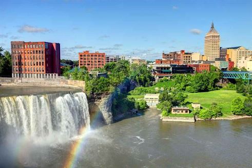 A waterfall with a rainbow over a river

AI-generated content may be incorrect.